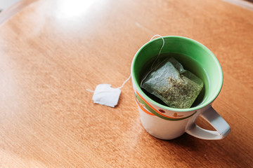 Top view of the tea cup on the wooden table. Healthy habits. Space for text