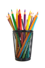 Bunch of colored pencils in a pencil holder. Macro still-file picture made in studio with white background and softbox.