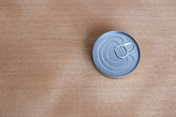 Canned tuna on the brown background