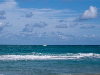 ocean with boat in the distance