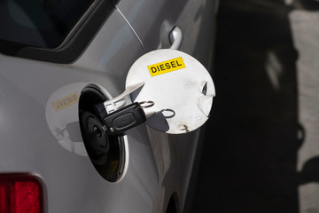 Fuel tank cover of a car with a diesel engine