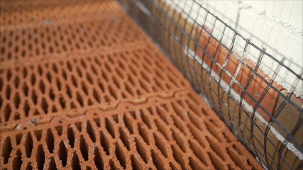 Isolated pile of builders bricks. Ceramic blocks stack