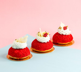 small red mountain cookies garnished with cream pistachio and raspberry