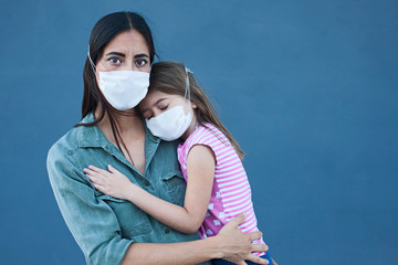 Mother and daughter with a face mask