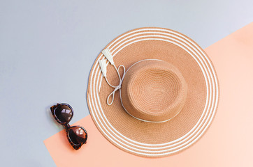 Fototapeta na wymiar Summer straw hat on colorful background. Holiday concept, copyspace