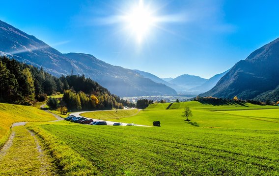 View on Alps mountains with green fields and sun in Tyrol, Austria. Nearby Motz, Fernpass