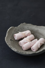 Special fabric cloth material made of wool. Rolled silk ribbon tied up on cement bowl. Perfect props for table decoration fashion arts material. Use on light pink for wedding motif.