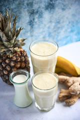 White smoothie with banana, pineapple and ginger