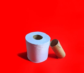 Rolls of toilet paper on red background. hygiene concept