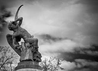 Sculpture  of  Fallen Angel in El Retiro park Madrid Spain