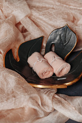 Special silk ribbon on leaf shape plate with fabric cloth made of wool. Perfect props for table decoration. A decorative light peach color motif for wedding and other event.