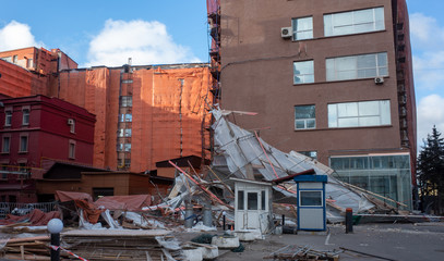 Scaffolding collapsed from a strong wind near a reconstructed multi-storey building in the city...