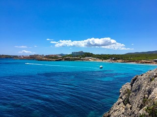 Beautiful aerial view on cala nova beach, blue sky and sea. Ibiza, Balearic Islands, Spain