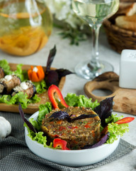 a bowl of smoked aubergine salad with tomato bell pepper onion and herbs