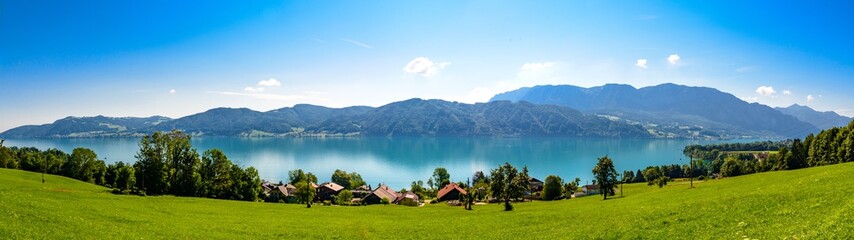 Beautiful panorama countryside  view on Attersee lake im Salzkammergut alps mountains by in Nussdorf, Zell am Attersee. Upper Austria, nearby Salzburg. - obrazy, fototapety, plakaty