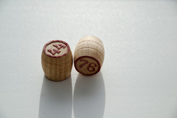 small wooden barrels with numbers on a white background.