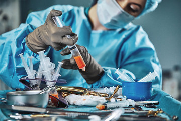 A set of operations for transplanting fat. Assistant surgeon doing the separation of fat before...