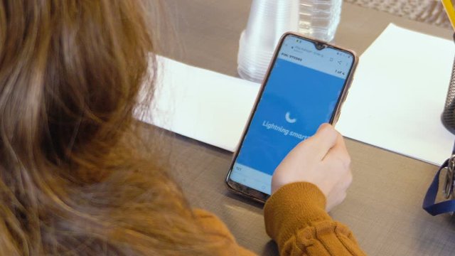 Tel Aviv, Israel - Dec 27, 2019: Israeli elementary caucasian teen girl plays "Kahoot!" with her phone in a classroom lesson. An online game-based learning platform used as educational technology.