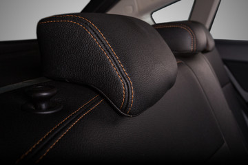 the interior of the car is covered with handmade genuine leather. the headrest of the rear bench seat