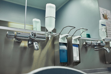Hand wash room in the hospital. Modern preoperative room for disinfection of disinfection of...
