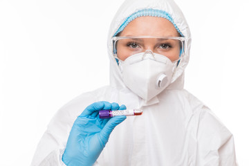 Female doctor with a sample blood test tube of Covid-19. Coronavirus concept