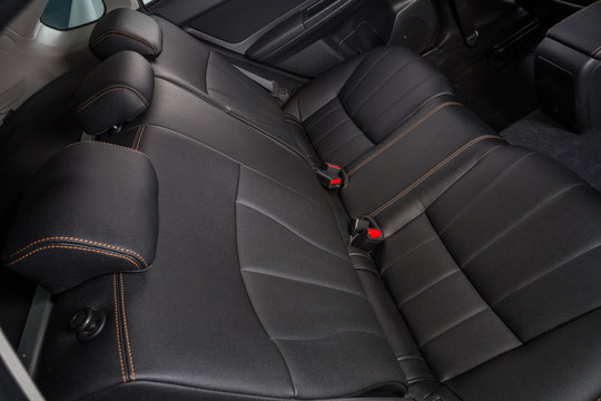 The Interior Of The Car Is Covered With Handmade Genuine Leather. Back Row Of Car Seats. General View