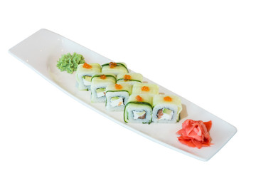 A portion of sushi with tuna, cucumber and red caviar on a white plate. Pickled ginger and wasabi. on white background