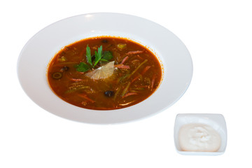 A plate of soup-Russian borscht with sour cream. on white background