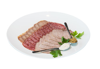 A portion of sliced meat delicacies, sausage, served with mustard and horseradish. on white background