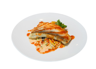 fried fish with tomato sauce and vegetables