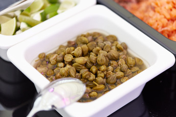 A tray of capers on a plate
