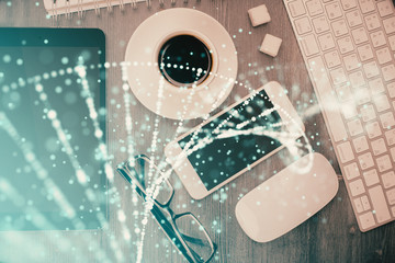 Double exposure of DNA drawing over table with phone. Top view. Science education concept.