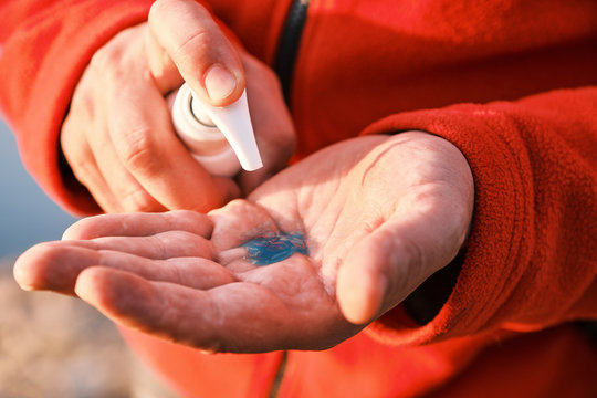 man hands using alcohol antiseptic gel in sanitizer bottle for frequently cleaning and prevent infection coronavirus