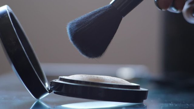 Professional makeup brushes in a make-up kit close up chenging focus Brush, Comb, Eye Shadow in a leather bag