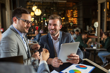 Managers analyzing business project in restaurant