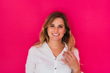 smiling young girl on pink background