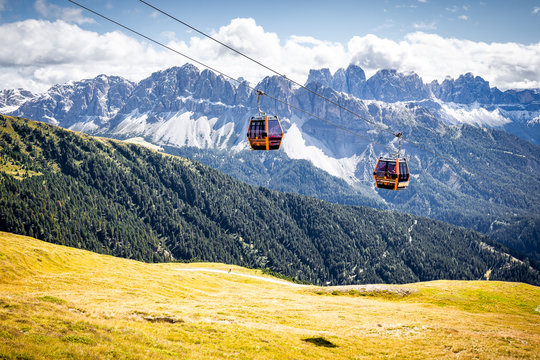 Two cable cars aerial lift tram South Tyrol mountains, Italy.