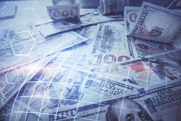 Double exposure of world map drawing over us dollars bill background. International concept.