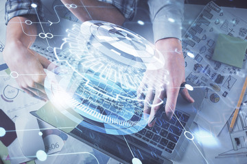 Double exposure of man and woman working together and data theme hologram drawing. Computer background. Top View.