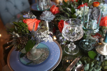 table setting, blue plate, glass vine, orange rose, blue candle