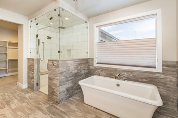 Fototapeta na wymiar Elegant Farm House Master Bathroom with Soaking Tub