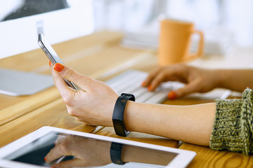 Young woman working with graphic tablet in office