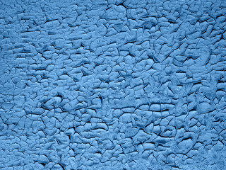 old peeling paint on wooden background. Classic blue color.