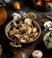 close up of sauteed mushroom garnished with parmesan