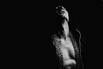 Boxer in a corner with a chain on his back and pumped body. Beauty and fashion. Body. Life. Sport. Anatomy.
