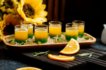 glasses of ombre juice with mint and orange