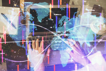 Double exposure of woman hands typing on computer and business theme hologram drawing. Success...