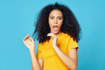 young woman with finger on lips