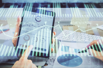 Multi exposure of man's hands holding and using a digital device and data theme drawing. Innovation concept.