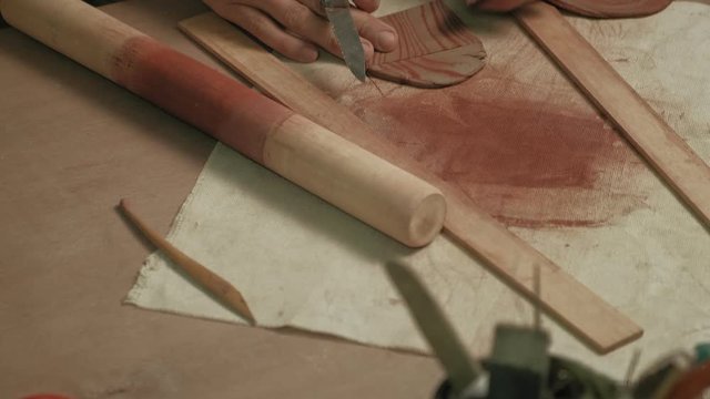 Ceramist work in the workshop.